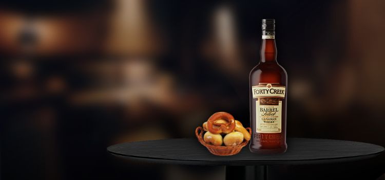 Forty Creek Canadian Whisky on table with bread