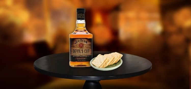 Jim Beam Devil’s Cut on desk with crackers