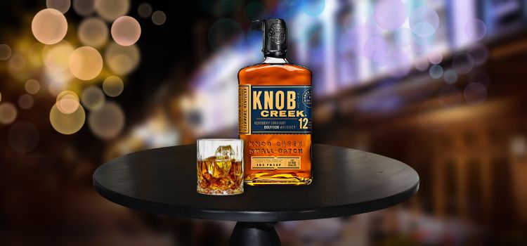 Knob Creek 12 on table with glass