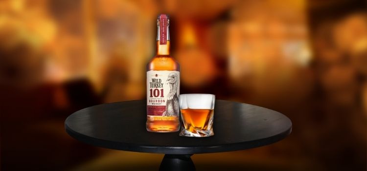 Wild Turkey 101 on desk, best bourbon for the money