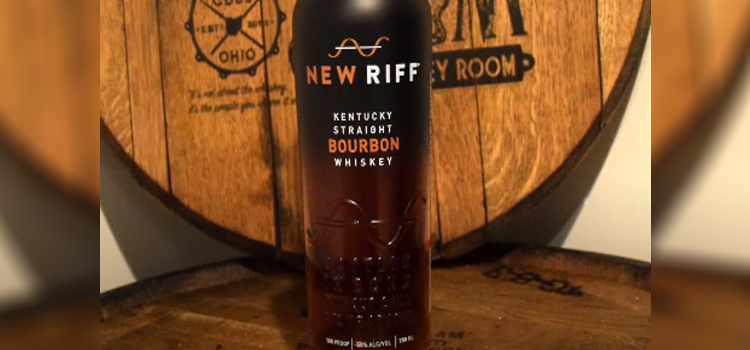 New Riff Bottled-In-Bond Bourbon Bottle on top of a barrel