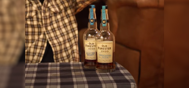 Bottles of Old Forester 1920 & 1910 on top of a table