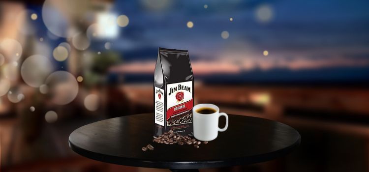 Jim Beam Bourbon Flavored Coffee with mug and coffee beans on top of table