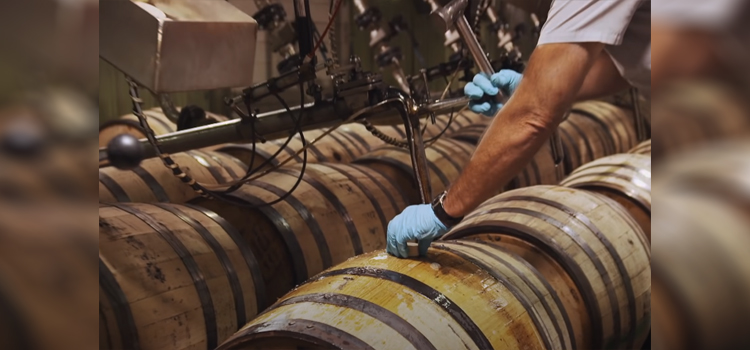 refilling whiskey barrel