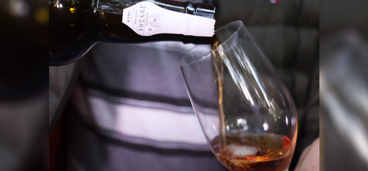 Pouring Madeira Wine on a Glass