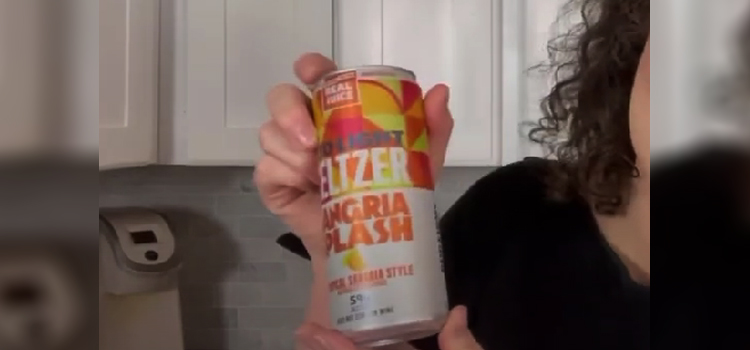 Woman Holding Can of Bud Light Seltzer Tropical Sangria Style