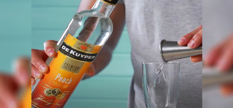 Bottle of De Kuyper Peach Schnapps, Glasses and a Jigger
