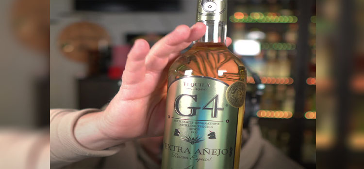 Man Holding Bottle of G4 Extra Anejo