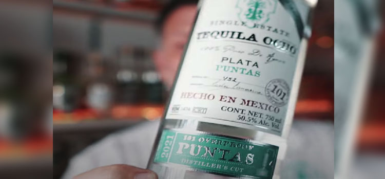 Man Holding Bottle of Tequila Ocho Plata