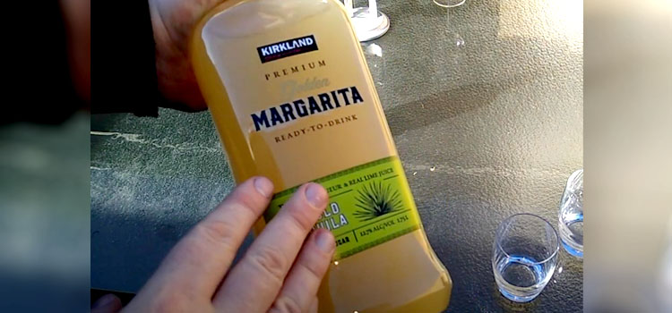 Hand Holding Bottle of Kirkland's Signature Golden Margarita Premium