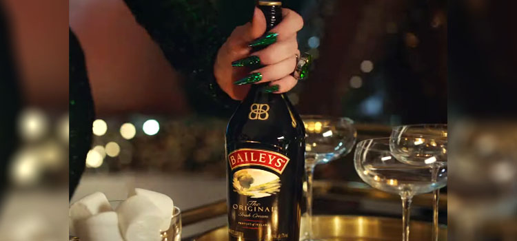 Woman Holding Bottle of Bailey's Irish Cream