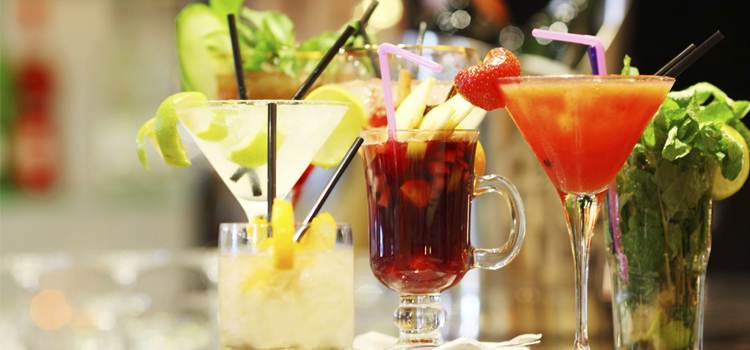 Assorted cocktails on a bar, magazine-era cocktail recipes photo